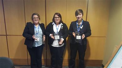 three BPA students holding awards