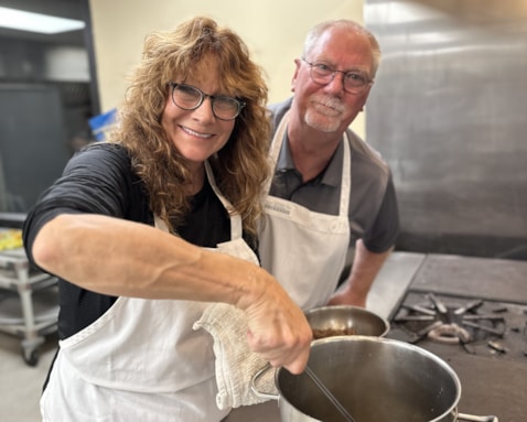 Two people taking a cooking class