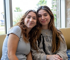 Two students sitting on campus