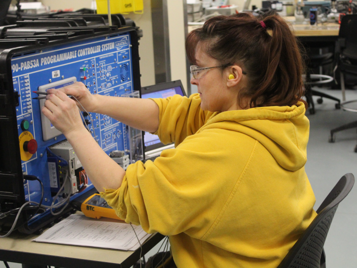 female student using programmable controller system