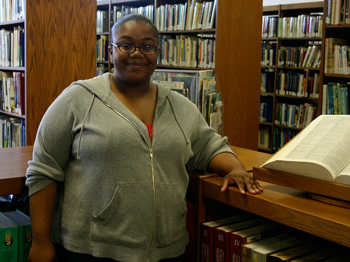 Student Standing in Library